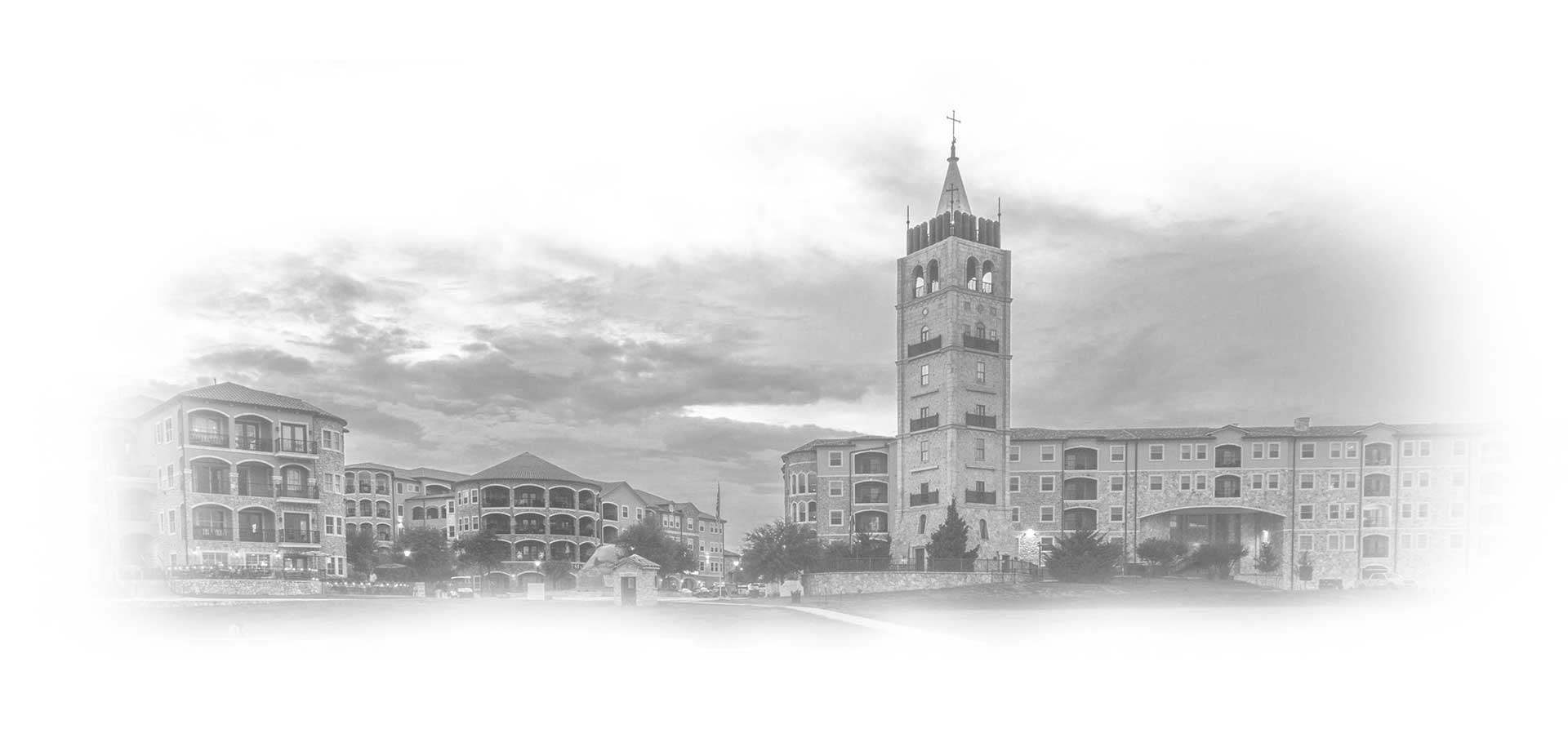 Black and white image of a Mediterranean-style residential complex with a prominent bell tower in the center, framed by elegant buildings under a cloudy sky.